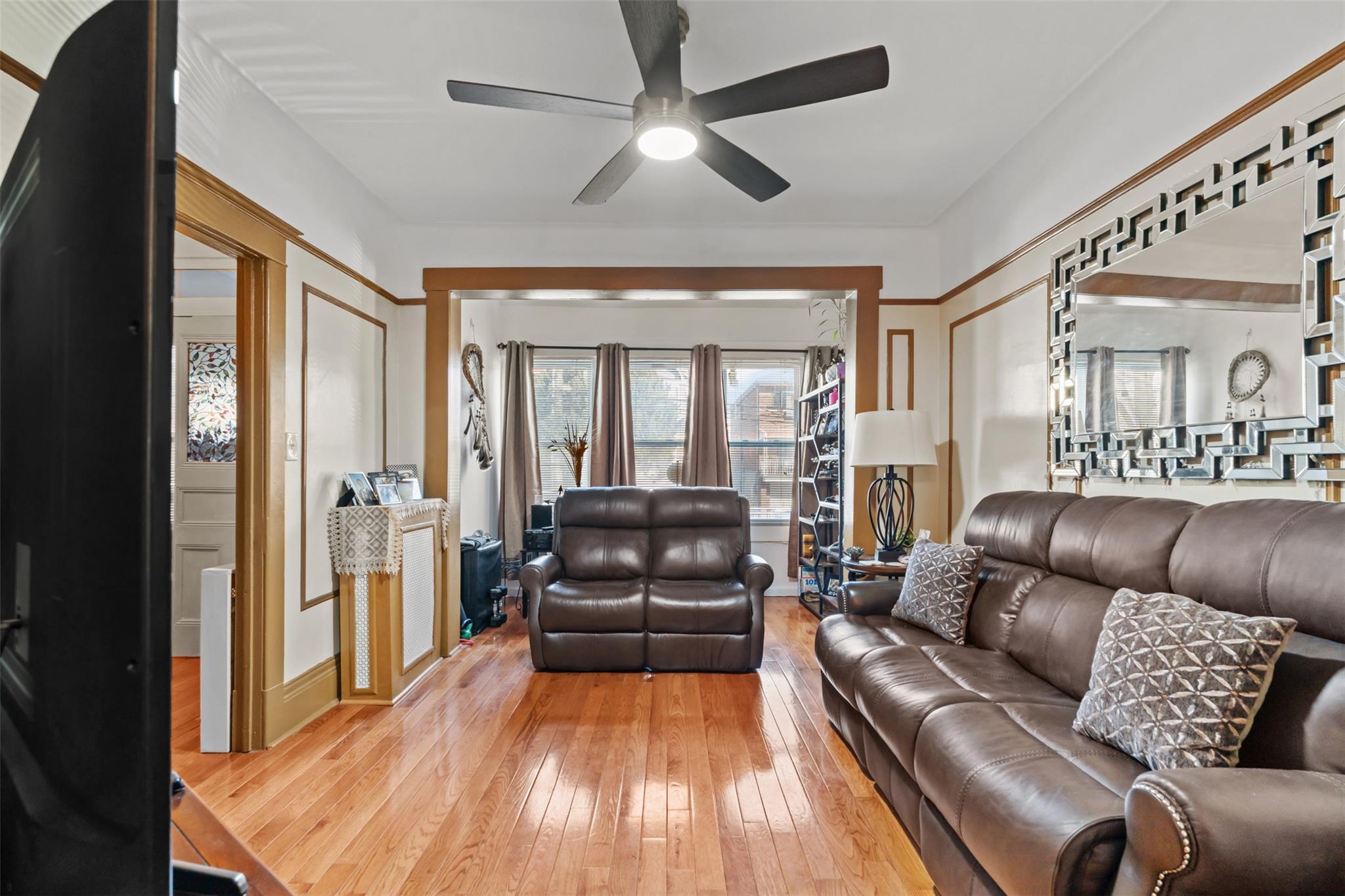 3943 Seton Avenue Bronx, NY 10466 - Photo 1 of 1 a living room with furniture and a large window