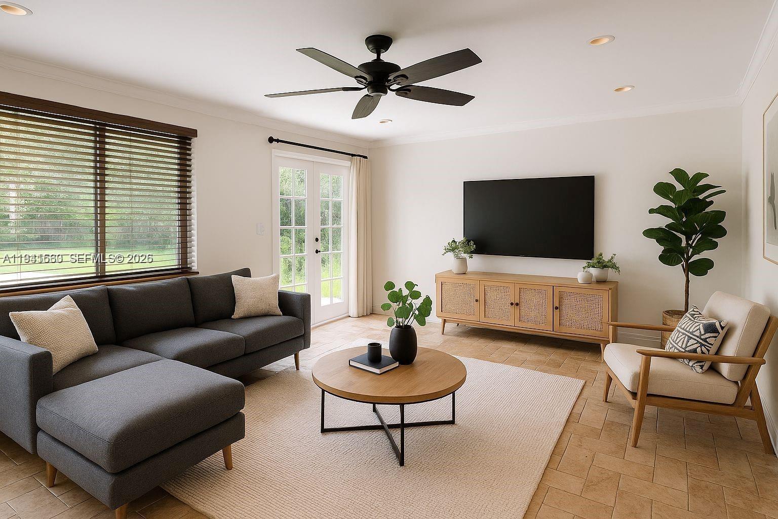 7350 Southwest 96th Street, Unit 7350 Pinecrest, FL 33156 - Photo 3 of 25 a living room with furniture and a flat screen tv