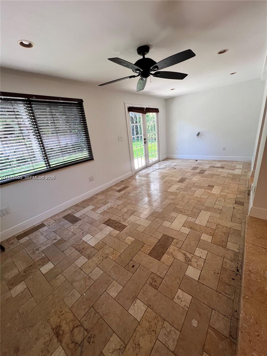 7350 Southwest 96th Street, Unit 7350 Pinecrest, FL 33156 - Photo 5 of 25 a view of an empty room