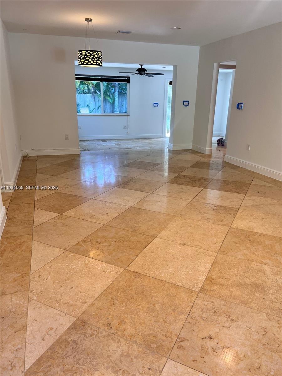 7350 Southwest 96th Street, Unit 7350 Pinecrest, FL 33156 - Photo 9 of 25 a view of a hallway with wooden floor