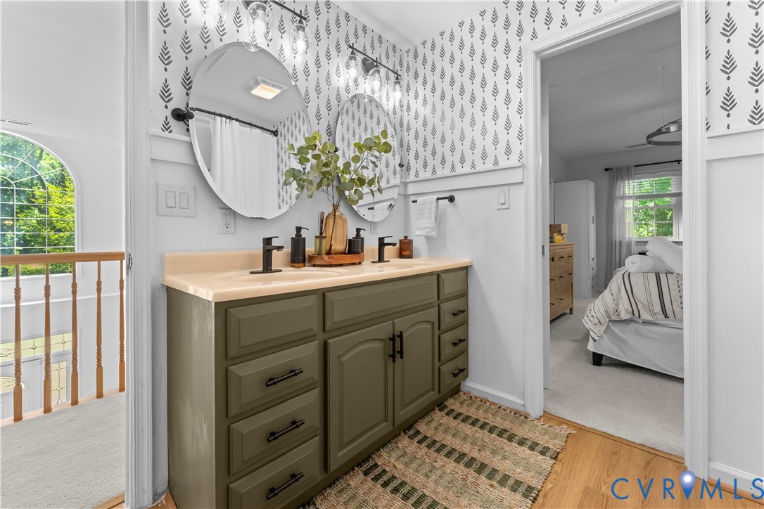 437 Plainview Road Kinsale, VA 22488 - Photo 50 of 63 a en suite bathroom with a double vanity sink and a mirror