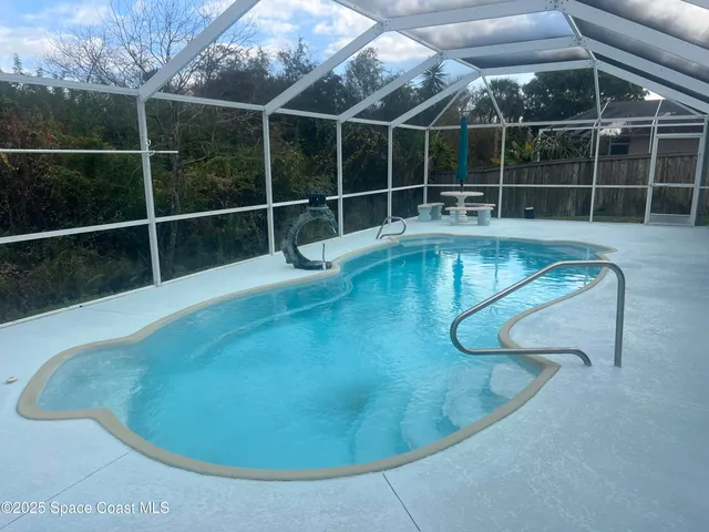 a view of a swimming pool with a room