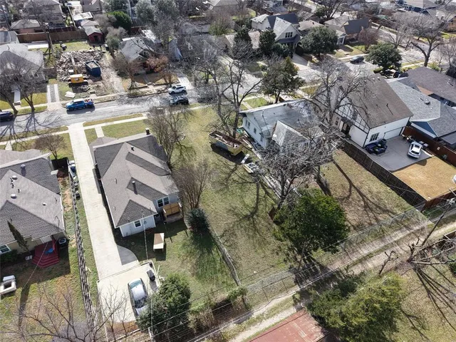 an aerial view of a house with outdoor space