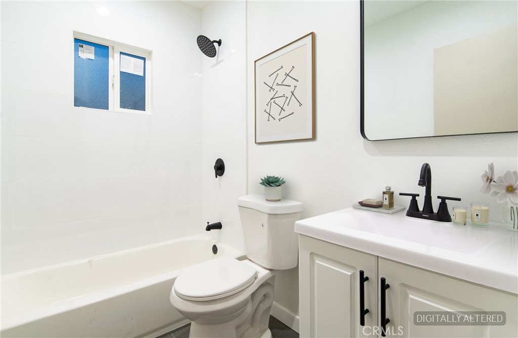 1100 East Tichenor Street Compton, CA 90221 - Photo 13 of 34 a bathroom with a sink a toilet and shower