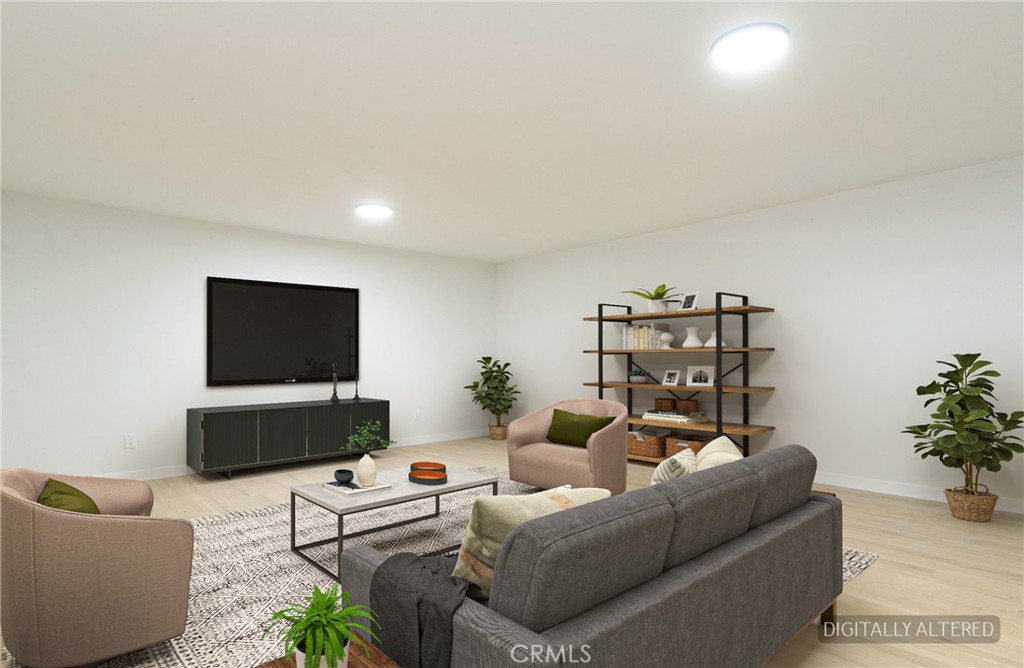 1100 East Tichenor Street Compton, CA 90221 - Photo 15 of 34 a living room with furniture and a flat screen tv
