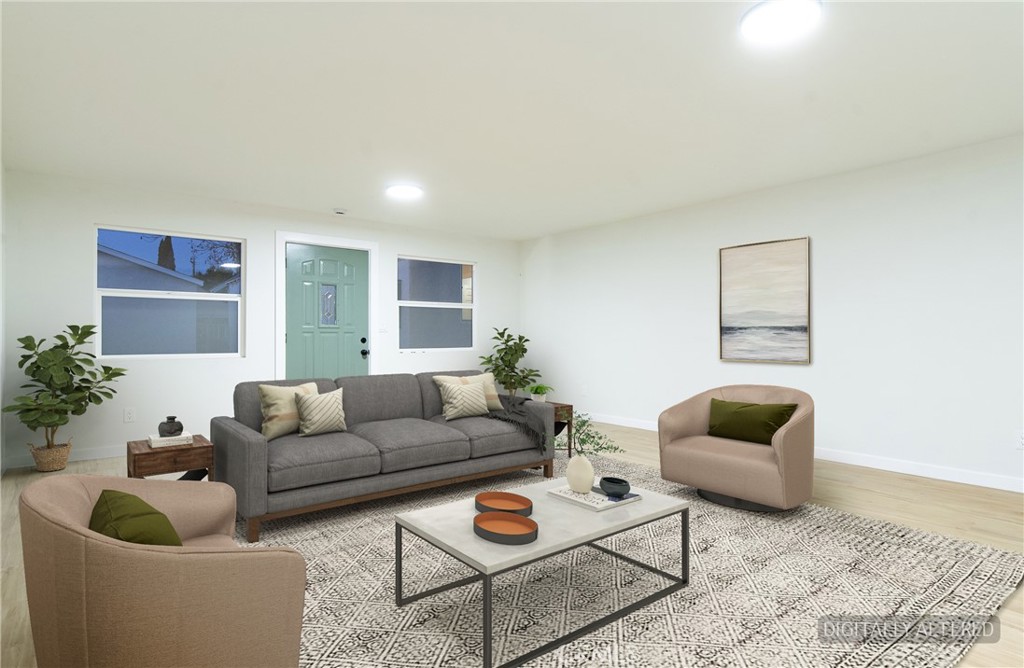 1100 East Tichenor Street Compton, CA 90221 - Photo 17 of 34 a living room with furniture and a wooden floor