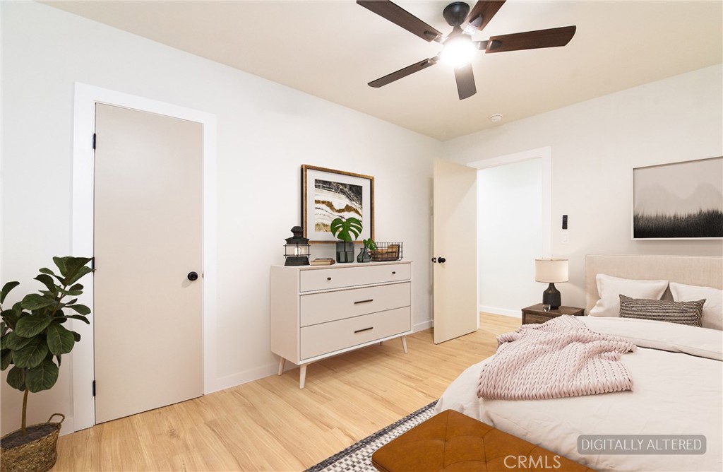 1100 East Tichenor Street Compton, CA 90221 - Photo 7 of 34 a bedroom with a bed and a dresser