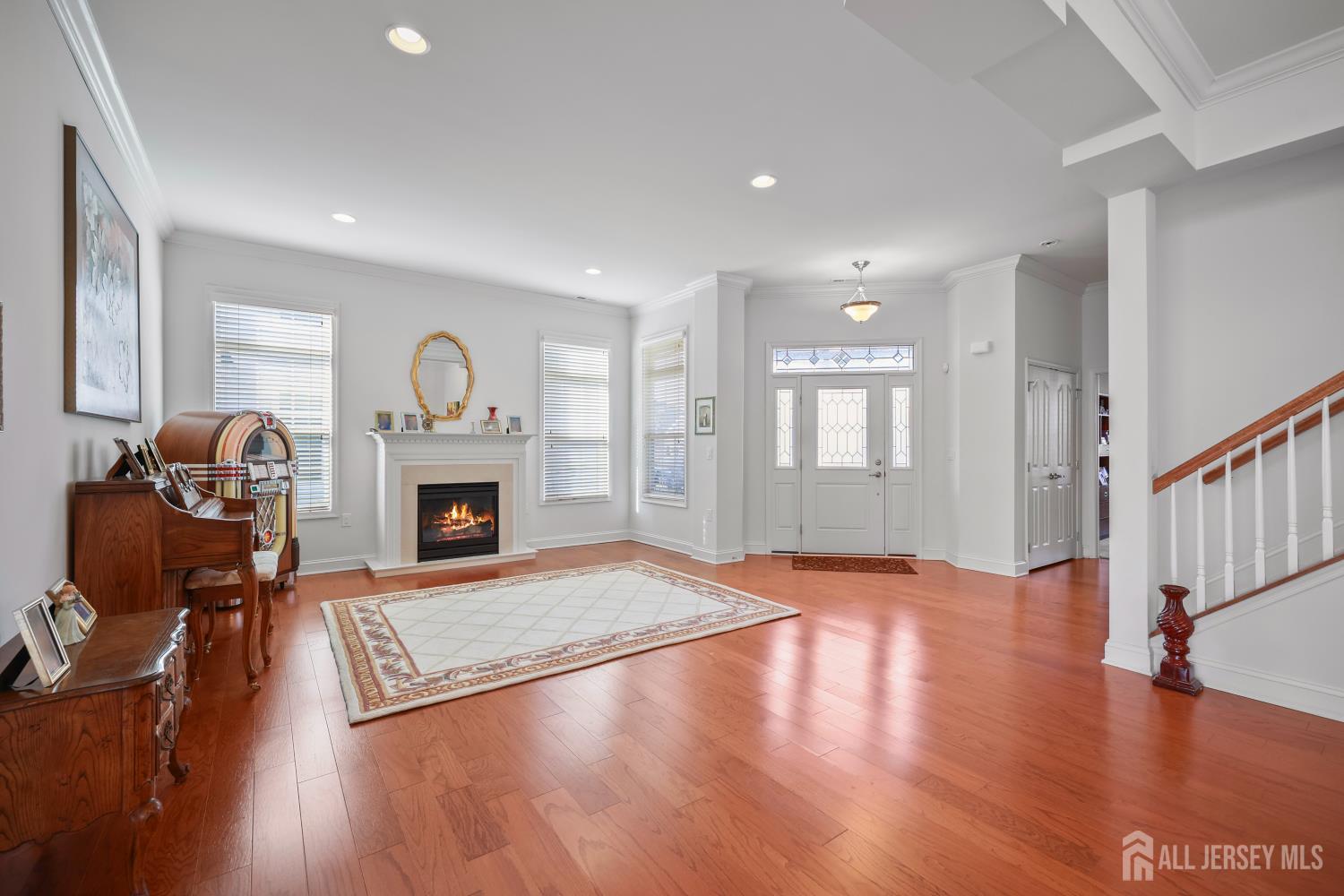 46 Mandrake Road Monroe Township, NJ 08831 - Photo 12 of 58 a view of a livingroom with a fireplace a window and a fireplace
