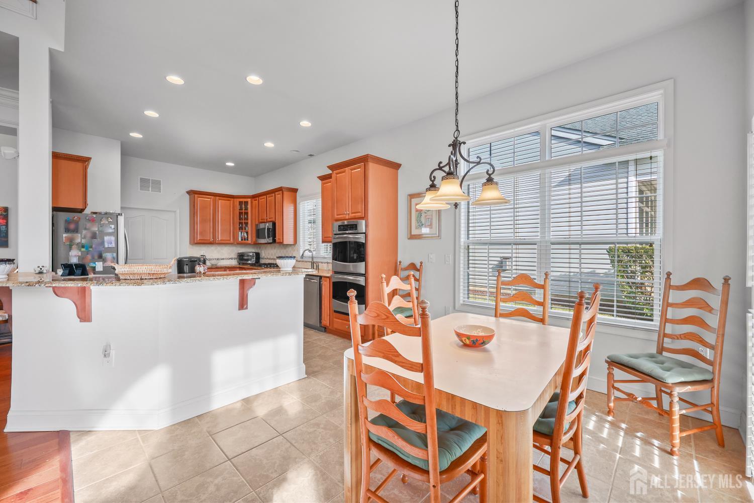 46 Mandrake Road Monroe Township, NJ 08831 - Photo 19 of 58 a dining table chairs and kitchen view