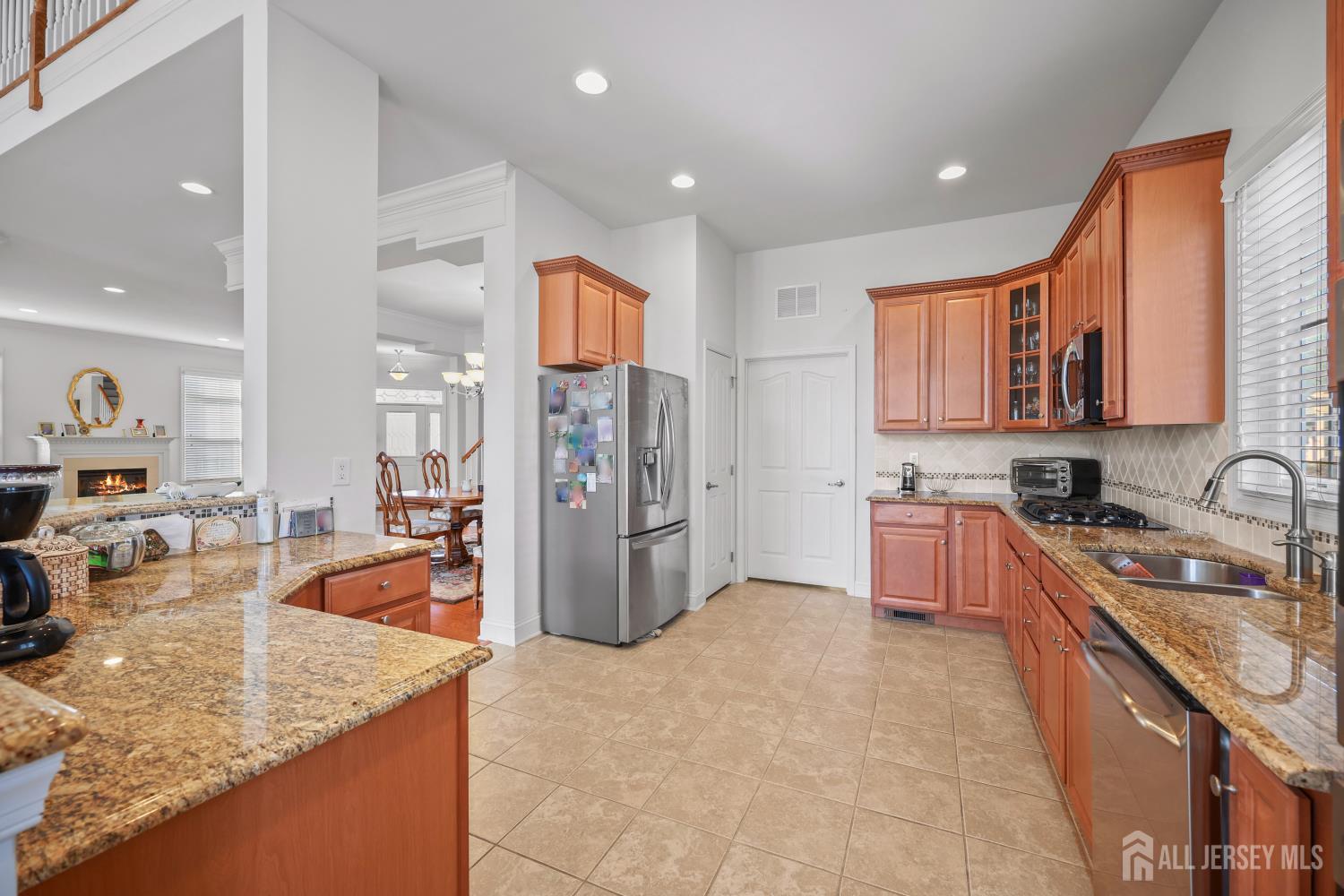 46 Mandrake Road Monroe Township, NJ 08831 - Photo 20 of 58 a large kitchen with stainless steel appliances granite countertop a lot of counter space and a sink