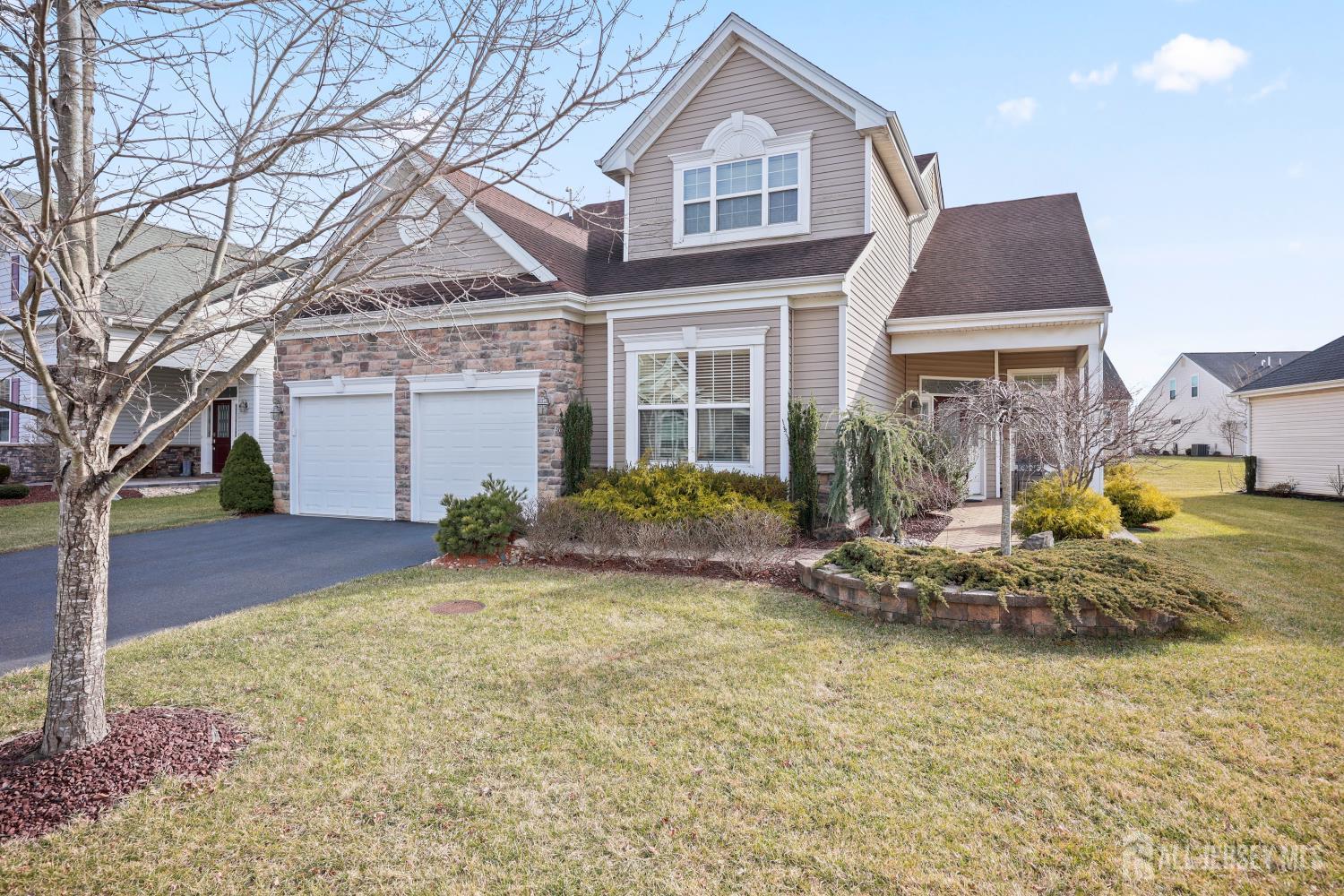 46 Mandrake Road Monroe Township, NJ 08831 - Photo 3 of 58 a front view of house with yard and trees in the background