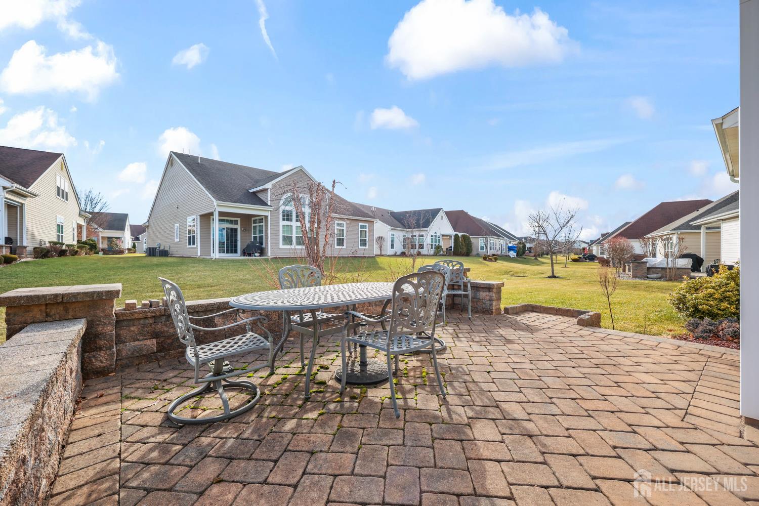 46 Mandrake Road Monroe Township, NJ 08831 - Photo 37 of 58 a view of a house with swimming pool and sitting area