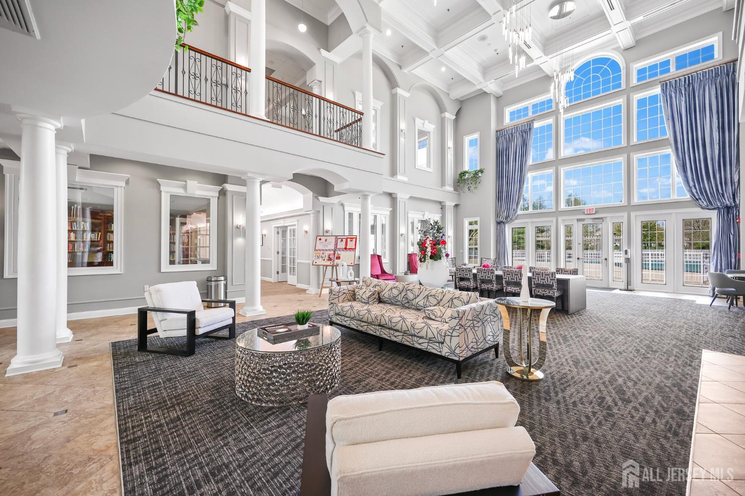 46 Mandrake Road Monroe Township, NJ 08831 - Photo 44 of 58 a living room with furniture and a chandelier