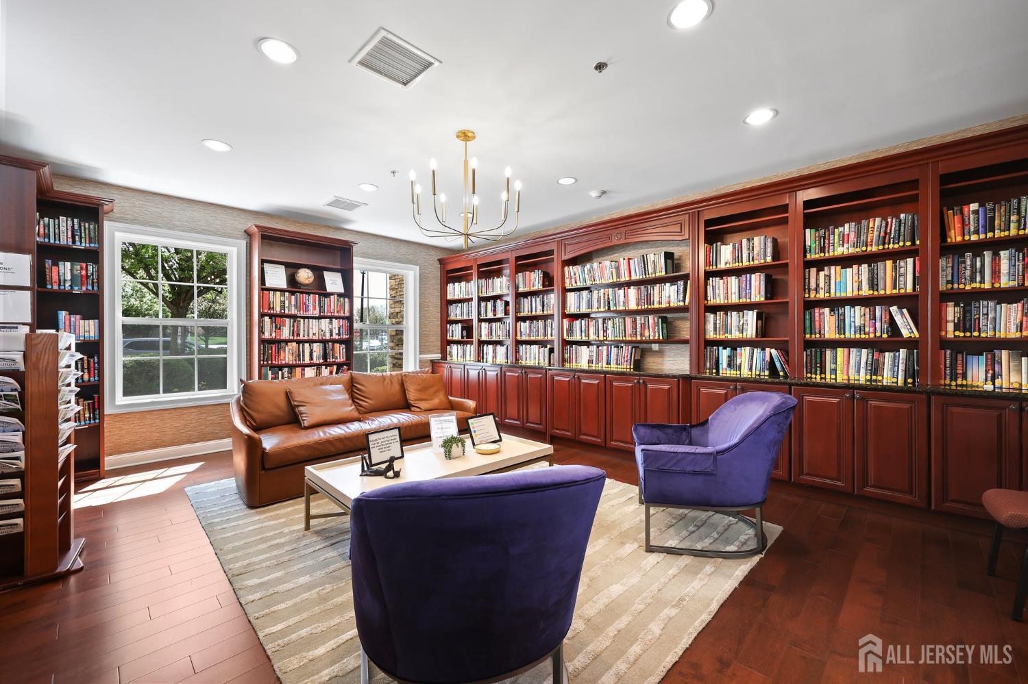 46 Mandrake Road Monroe Township, NJ 08831 - Photo 49 of 58 a living room with furniture and a book shelf