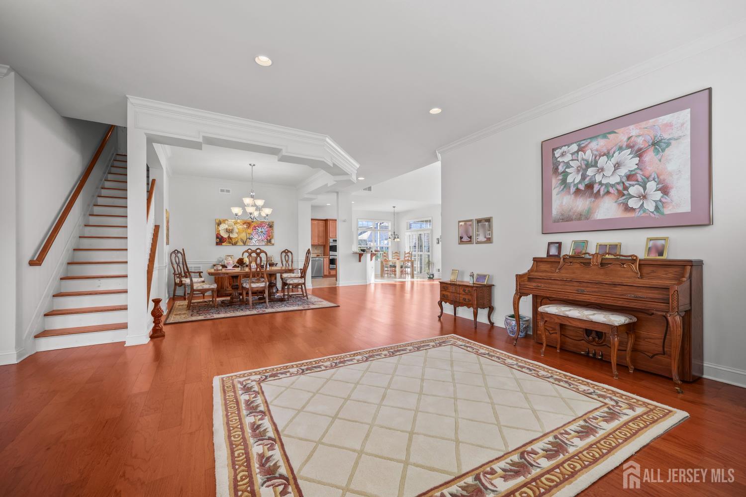 46 Mandrake Road Monroe Township, NJ 08831 - Photo 9 of 58 a living room with furniture a fireplace and wooden floor