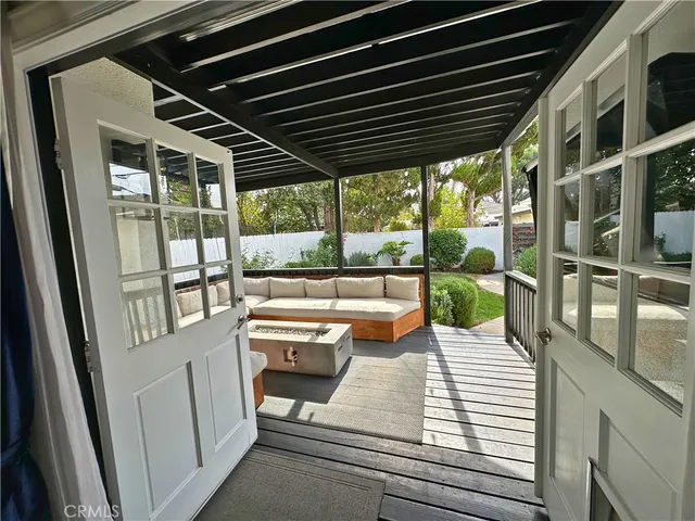 a room with furniture projector and screen