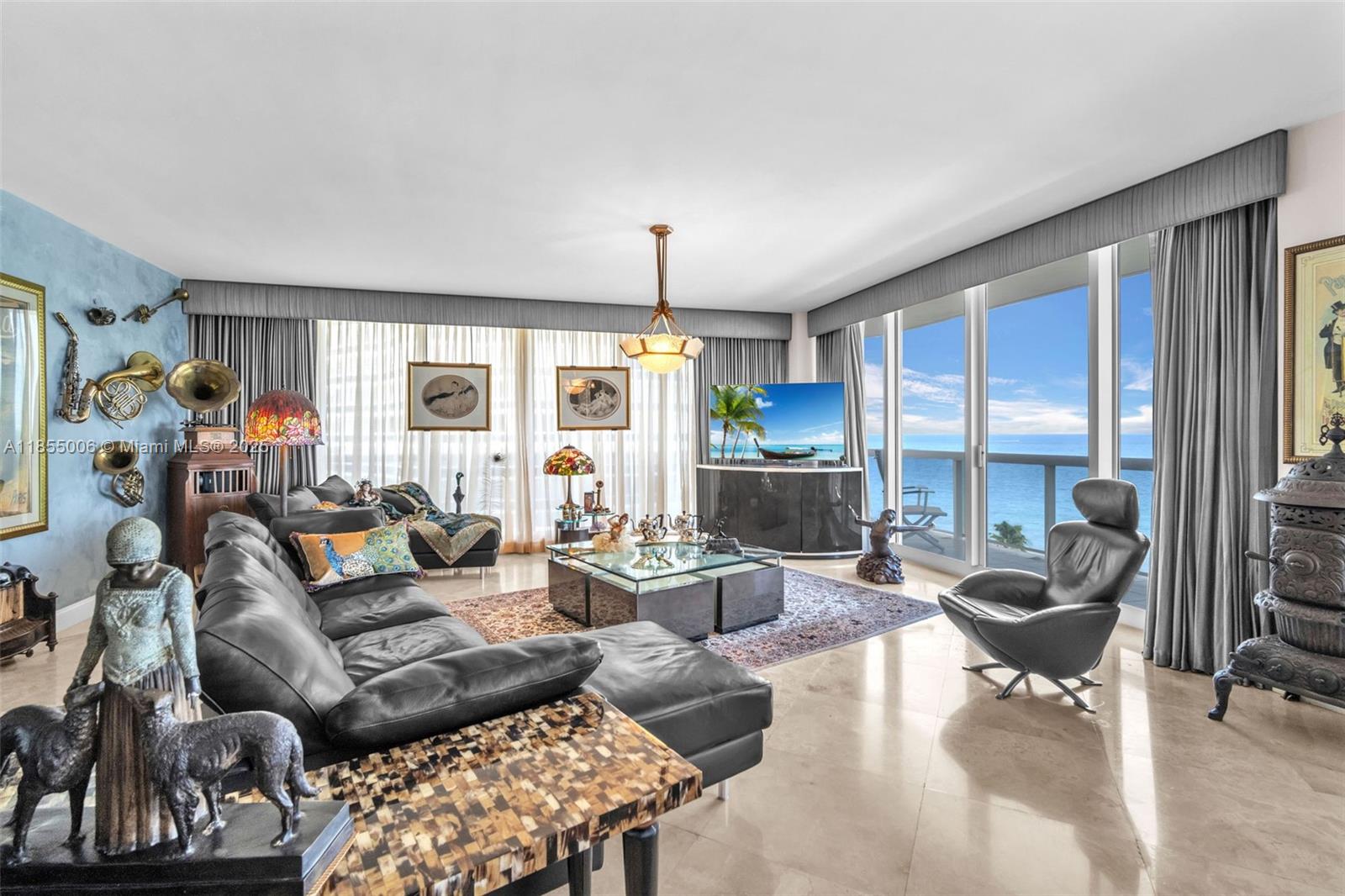 9595 Collins Avenue, Unit N9A Surfside, FL 33154 - Photo 24 of 66 a living room with furniture and a large window