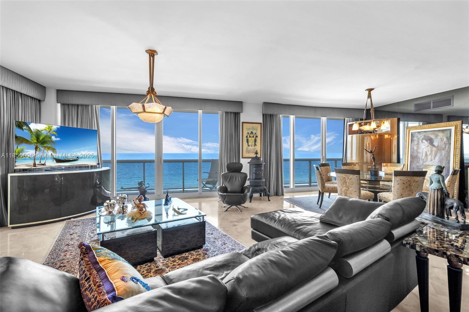 9595 Collins Avenue, Unit N9A Surfside, FL 33154 - Photo 25 of 66 a living room with furniture kitchen view and a chandelier