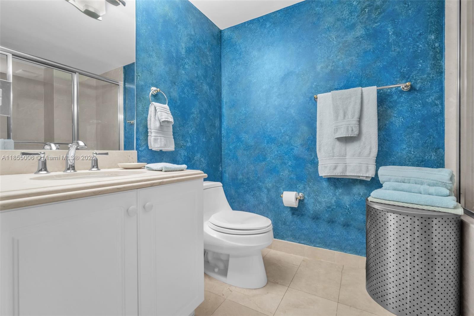 9595 Collins Avenue, Unit N9A Surfside, FL 33154 - Photo 33 of 66 a bathroom with a sink a toilet and mirror