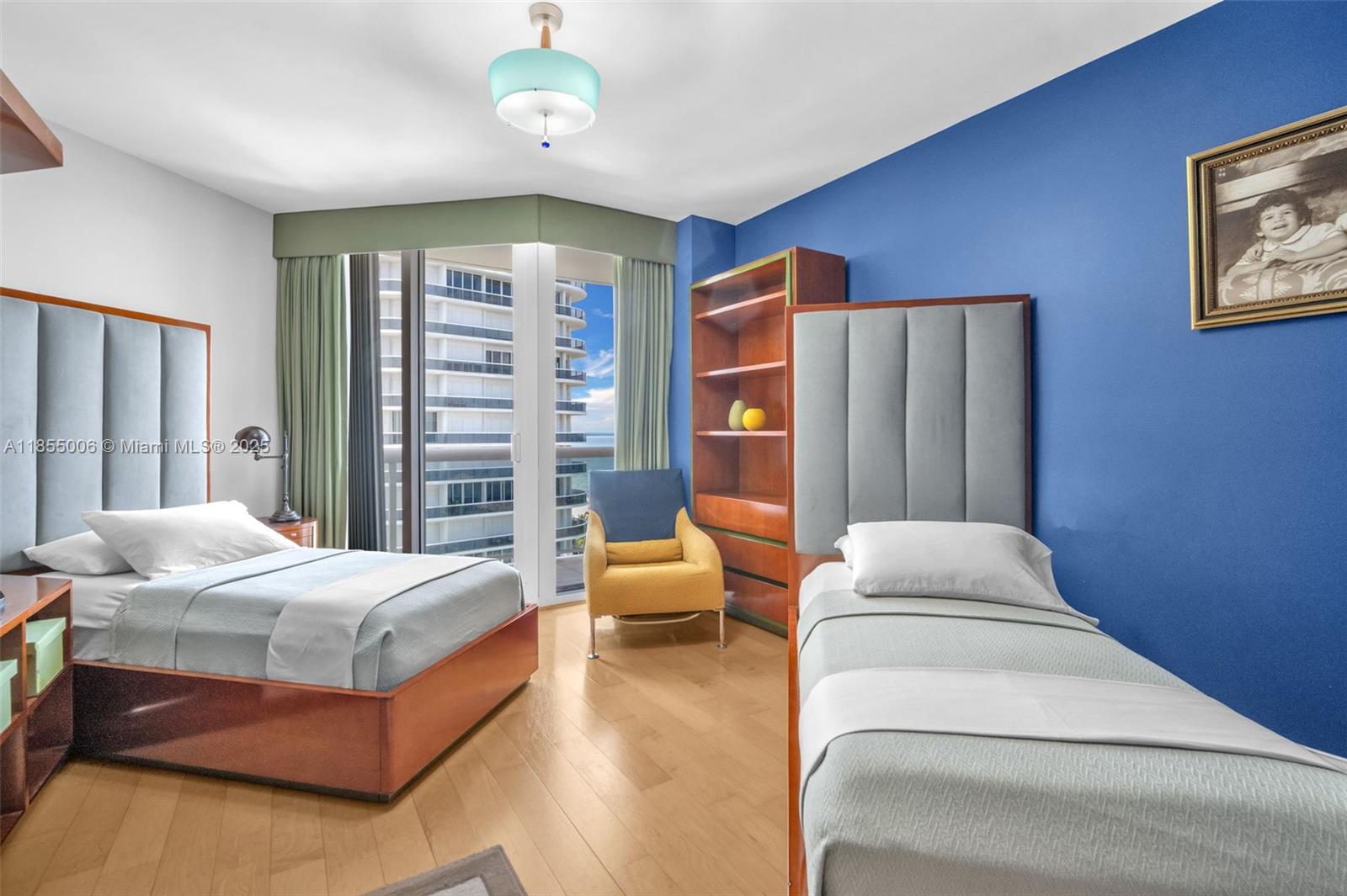 9595 Collins Avenue, Unit N9A Surfside, FL 33154 - Photo 38 of 66 a bedroom with a bed and wooden floor