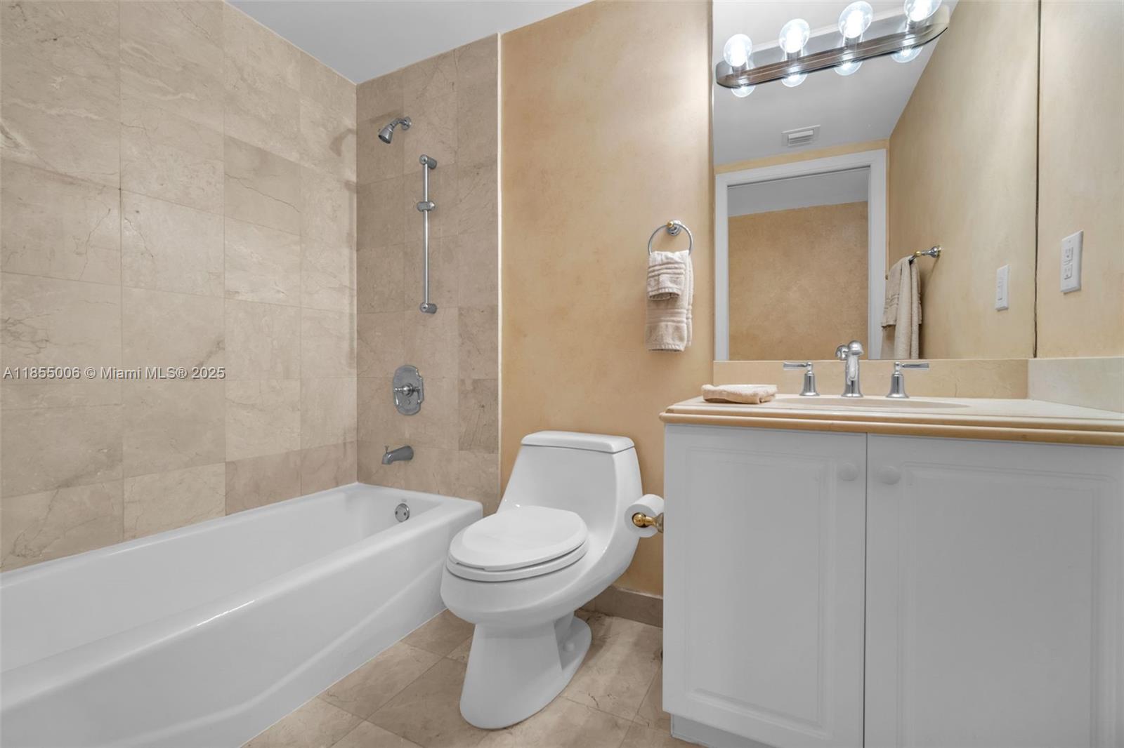 9595 Collins Avenue, Unit N9A Surfside, FL 33154 - Photo 43 of 66 a bathroom with a toilet sink and shower