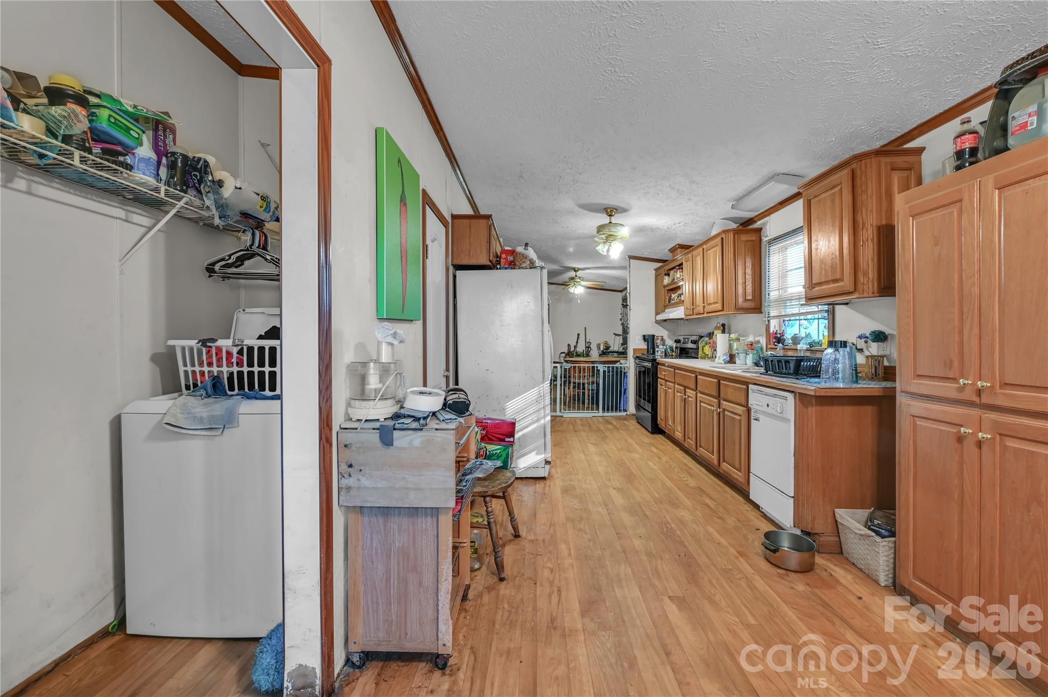 2571 Major Evans Road Lancaster, SC 29720 - Photo 6 of 19 a kitchen with a refrigerator and wooden floor
