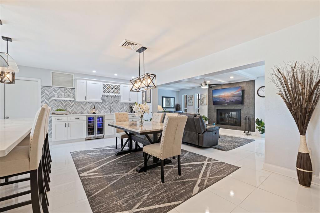 4781 97th Way North St. Petersburg, FL 33708 - Photo 11 of 47 a dining room with furniture a chandelier and wooden floor