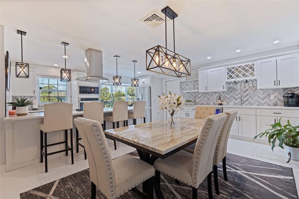 4781 97th Way North St. Petersburg, FL 33708 - Photo 13 of 47 a view of a dining room with furniture