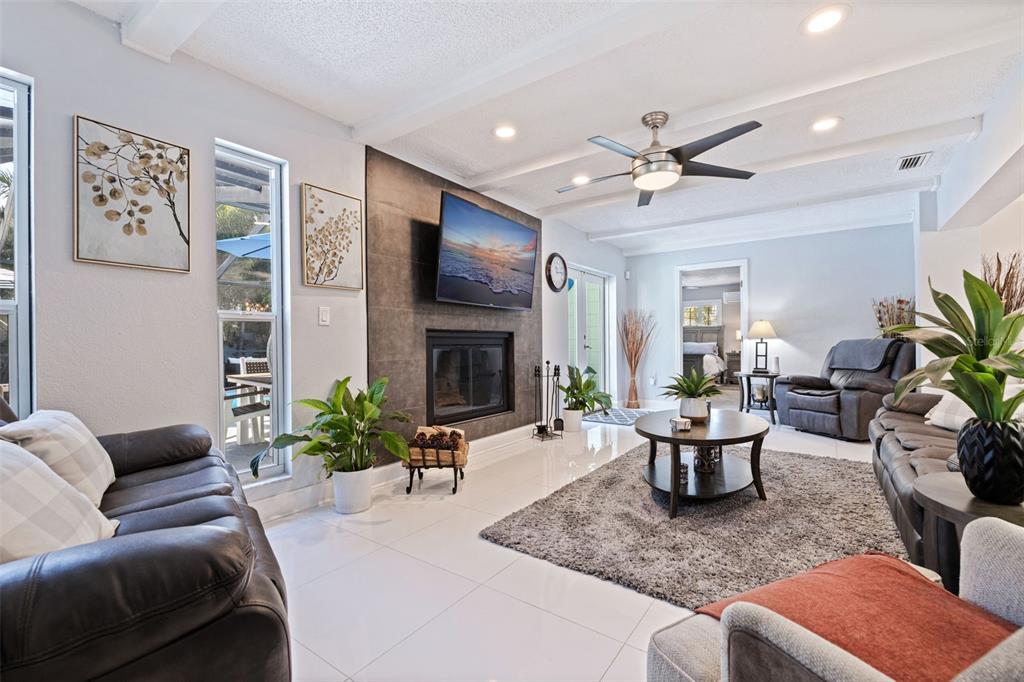 4781 97th Way North St. Petersburg, FL 33708 - Photo 15 of 47 a living room with furniture potted plant and a fireplace