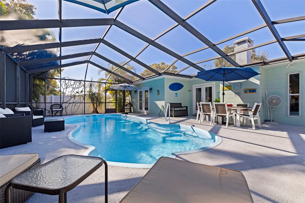4781 97th Way North St. Petersburg, FL 33708 - Photo 30 of 47 a view of a patio with a table and chairs