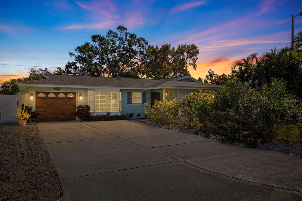 4781 97th Way North St. Petersburg, FL 33708 - Photo 3 of 47 front view of a house with a yard