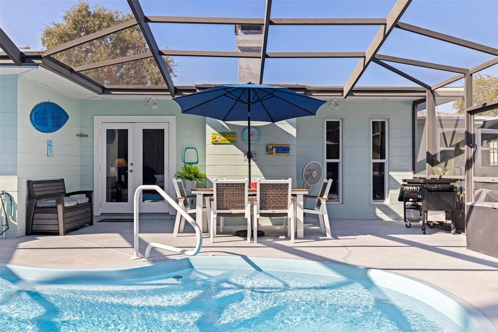 4781 97th Way North St. Petersburg, FL 33708 - Photo 33 of 47 a view of a chairs and table in the patio