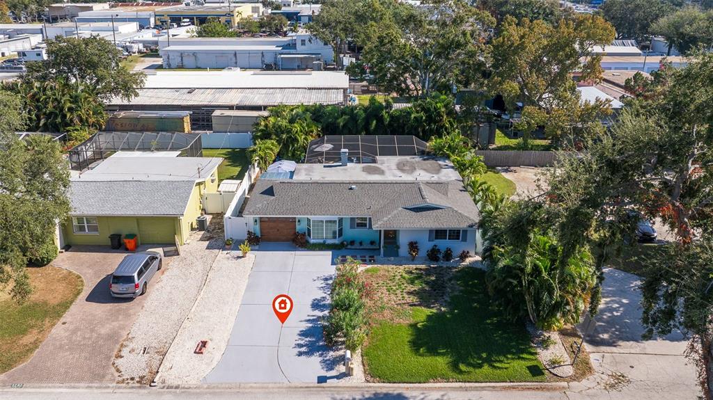 4781 97th Way North St. Petersburg, FL 33708 - Photo 38 of 47 a view of a patio with a table and chairs under an umbrella
