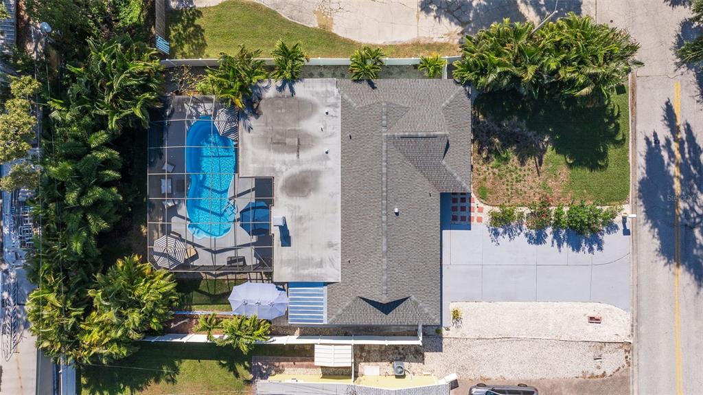 4781 97th Way North St. Petersburg, FL 33708 - Photo 40 of 47 an aerial view of a house with yard swimming pool and outdoor seating