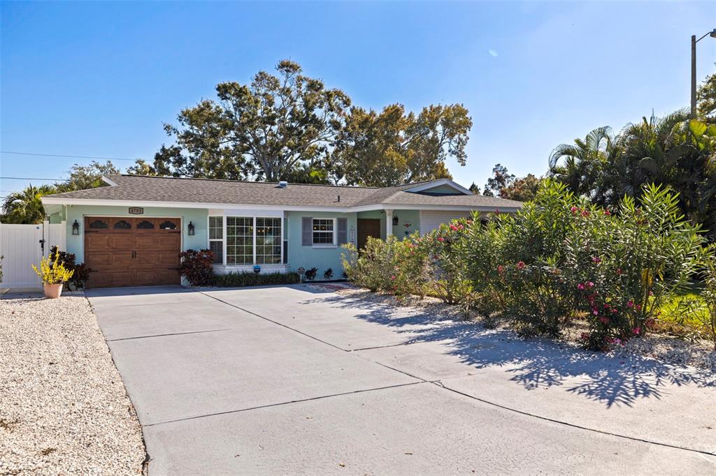 4781 97th Way North St. Petersburg, FL 33708 - Photo 4 of 47 front view of a house with a porch