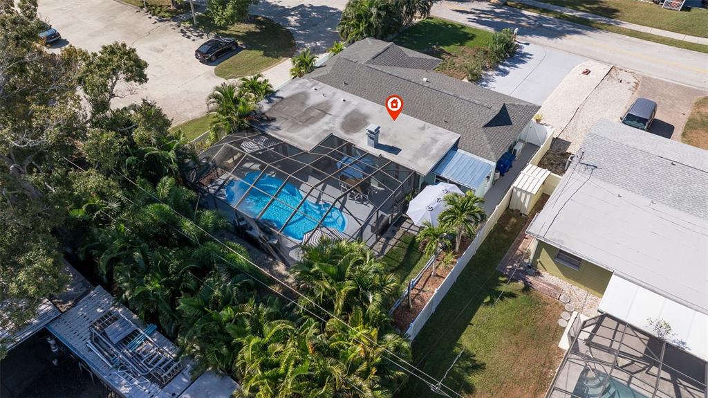 4781 97th Way North St. Petersburg, FL 33708 - Photo 41 of 47 an aerial view of a house with a yard and garden