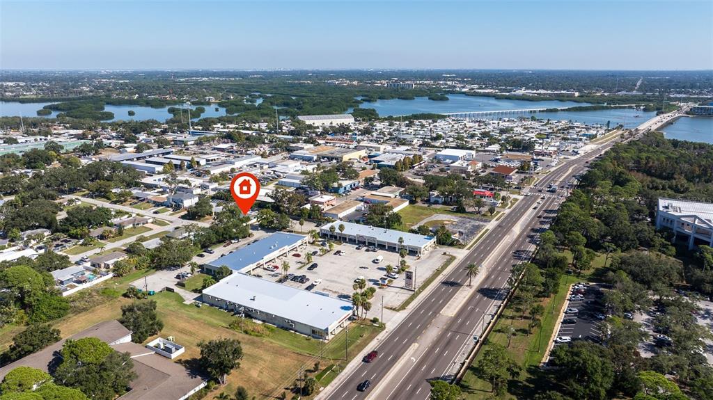 4781 97th Way North St. Petersburg, FL 33708 - Photo 47 of 47 an aerial view of a residential building with an outdoor space and seating