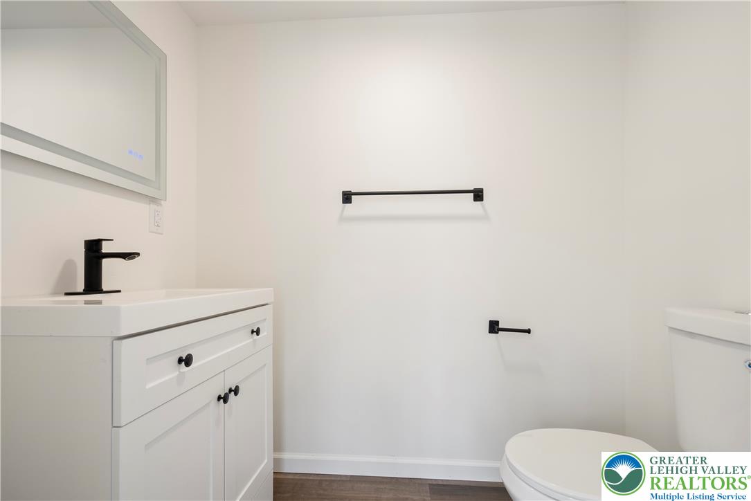 767 East Rock Road Allentown, PA 18103 - Photo 12 of 22 a bathroom with a sink a toilet and vanity