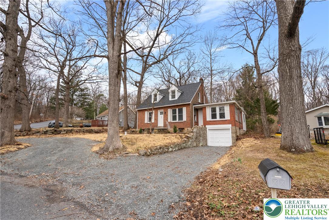 767 East Rock Road Allentown, PA 18103 - Photo 22 of 22 a front view of a house with a yard covered in snow