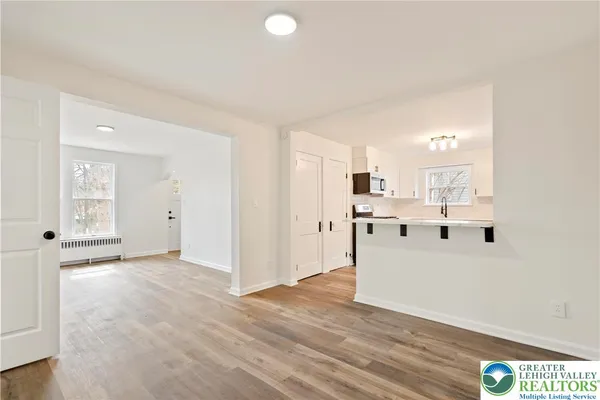 a view of kitchen with wooden floor