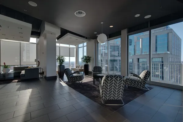 a living room with fireplace furniture and a flat screen tv