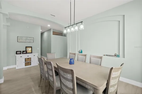 a view of a dining room with furniture and window