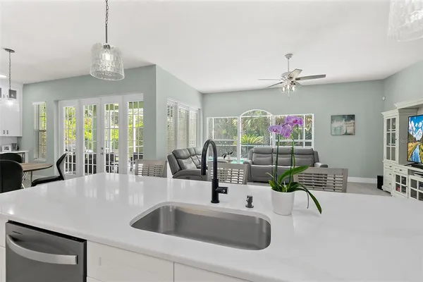 a bathroom with a double vanity sink toilet and shower