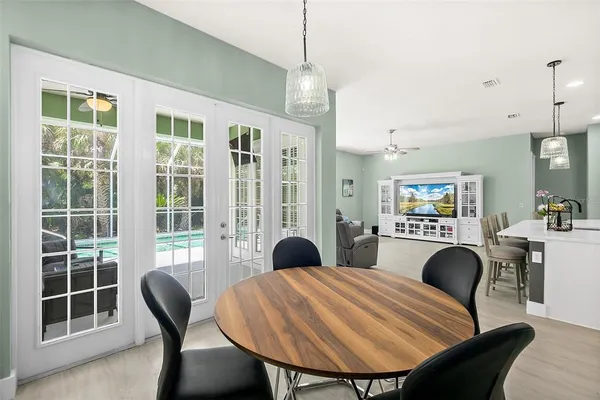 an aerial view of a house with a garden and lake view