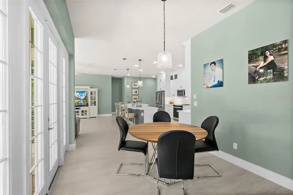 an aerial view of a house with a swimming pool yard and outdoor seating