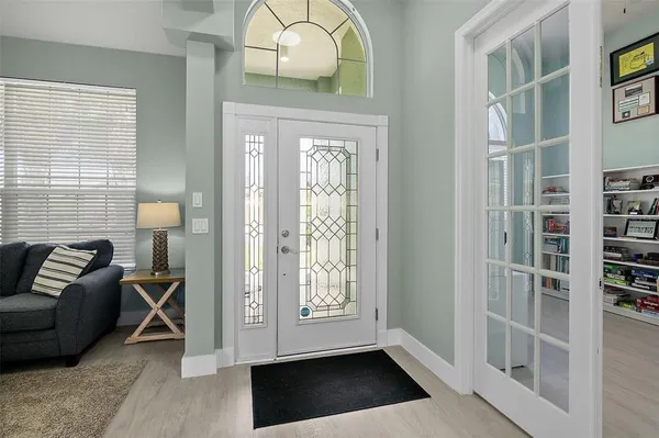 a view of a dining room with furniture window and wooden floor