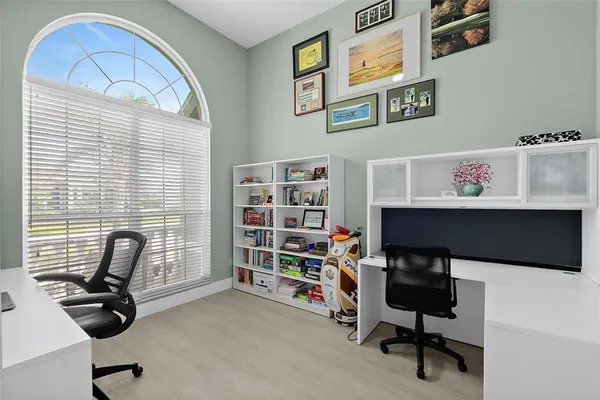 a dining room with furniture and window