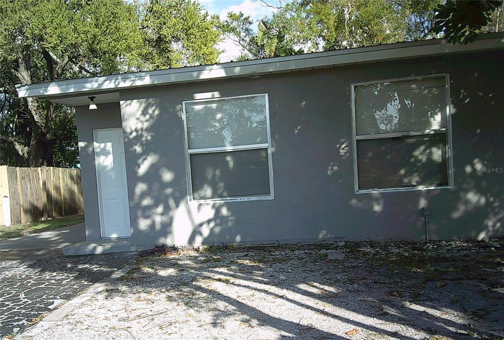 1060 65th Street South St. Petersburg, FL 33707 - Photo 1 of 20 a front view of a house with a yard