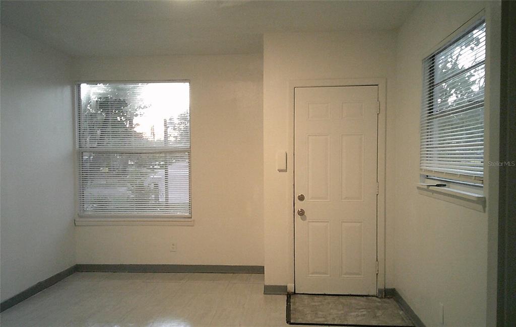 1060 65th Street South St. Petersburg, FL 33707 - Photo 3 of 20 an empty room with windows and closet