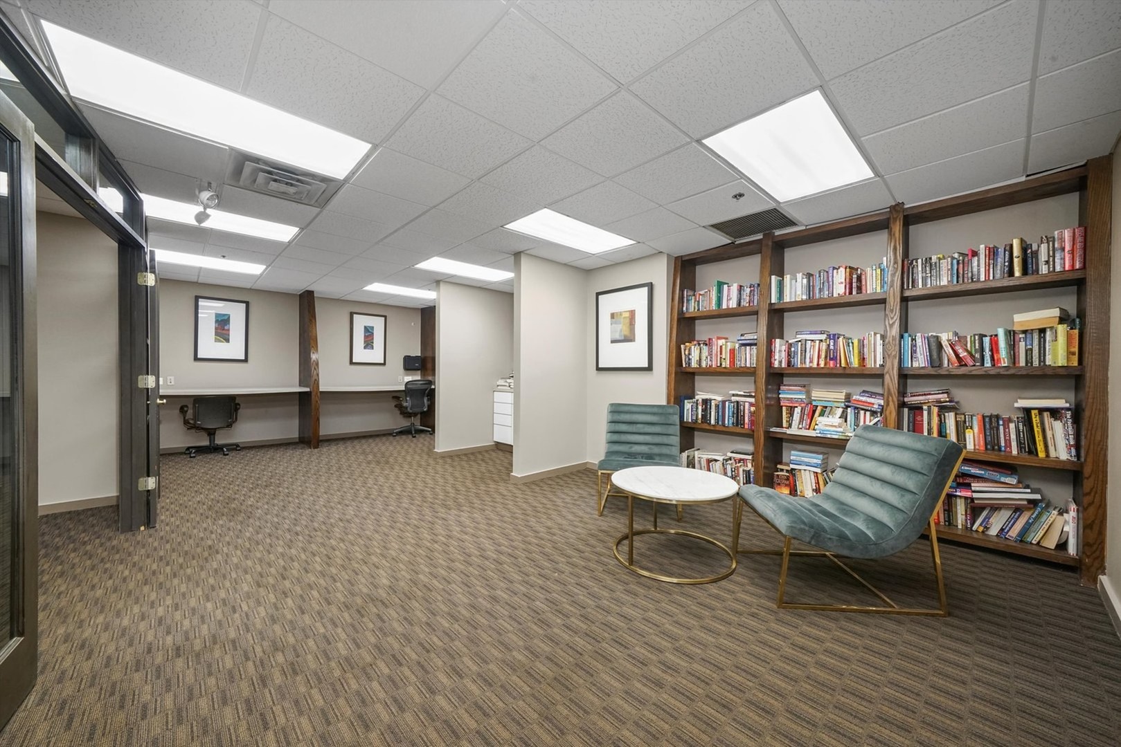 5320 North Sheridan Road, Unit 401 Chicago, IL 60640 - Photo 14 of 17 a living room with furniture and a book shelf